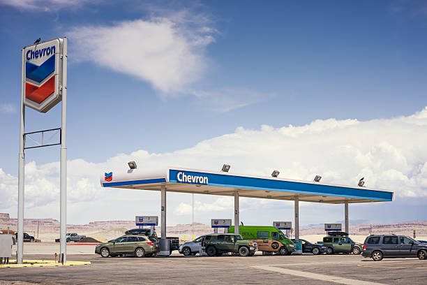 Green River, USA - Cars, trucks and vans at a rural Chevron gas station. 40012