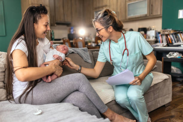 Female doctor at house visit,checking up newborn baby boy New opportunities press